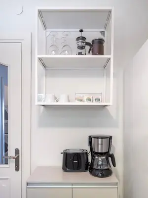a kitchen cabinet with a coffee maker on a counter at Stay Beyond the Bosphorus #6 in Istanbul