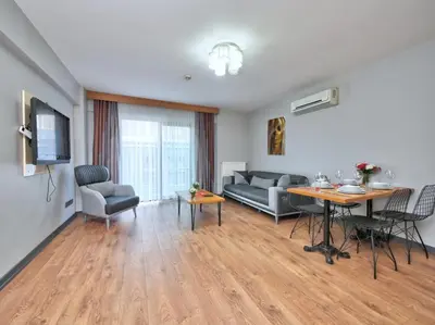 a living room with a couch and a table at Blueway Hotel Residence in Istanbul