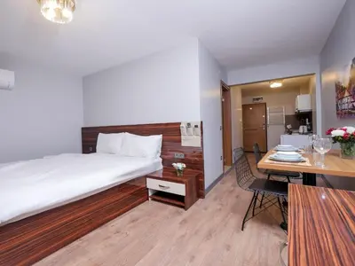 a hotel room with a large bed and a desk at Blueway Hotel Residence in Istanbul