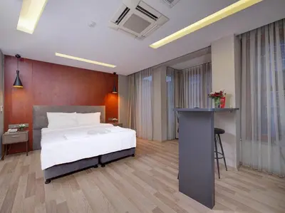 a bedroom with a bed and a desk in it at Blueway in Istanbul