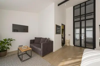 a living room with a couch and a table at Fitas Oda Hotel in Istanbul