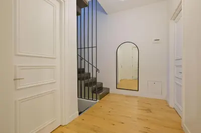 a hallway with a staircase and a mirror at Casa Isabel - Amazing 5Br House in Prime Location in Istanbul