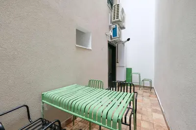 a room with chairs and a table and a wall at Casa Isabel - Amazing 5Br House in Prime Location in Istanbul