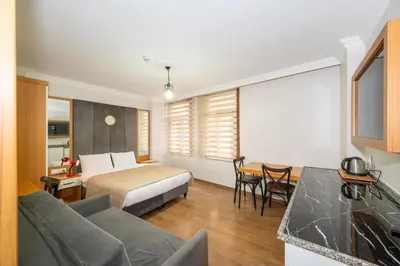 a hotel room with a bed and a table at Aras Life Hotel in Istanbul