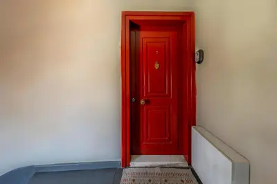 a red door in the side of a building at Golden Horn Hidden Haven in Istanbul