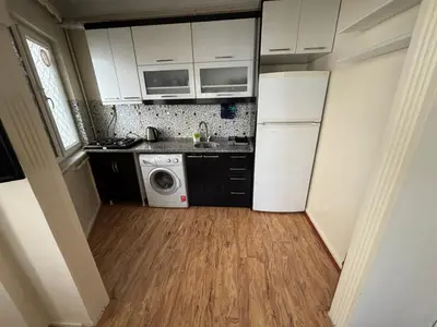 a kitchen with a refrigerator and a washing machine at Istanberry - Joker Apartments in Istanbul