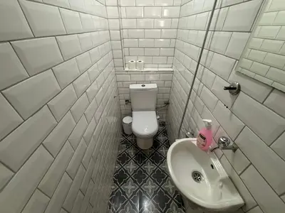 a bathroom with a white toilet and a sink at Istanberry - Joker Apartments in Istanbul