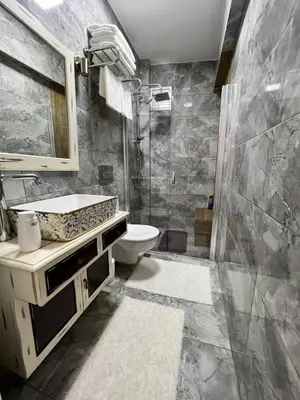 a bathroom with a sink and a toilet and a shower at Akaretler City View between Nişantaşı and Beşiktaş in Istanbul