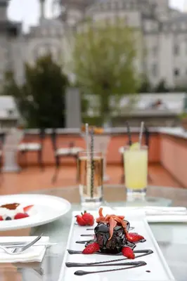 a chocolate dessert on a table with strawberries on it at Sultanahmet Palace Hotel in Istanbul