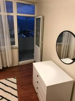 a white room with a mirror and a white dressing table at Bosphorus view, Great location and Cozy House! in Istanbul