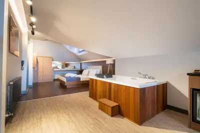 a bathroom with a sink and a bed in a room at 216 Bosphorus Suite in Istanbul