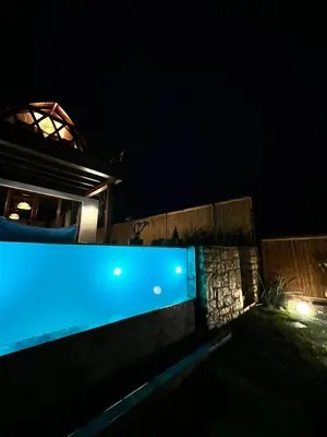a blue light on the side of a building at night at Exclusive Hill Sapanca in Sapanca