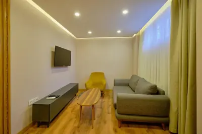 a living room with a couch and a table at Daire 1 Jakuzili in Beylikduzu