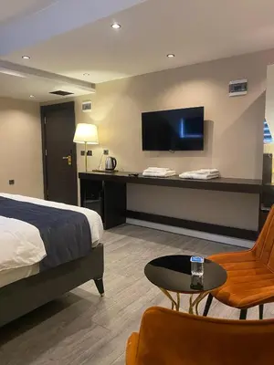 a hotel room with a bed and a flat screen tv at Grand Armada Hotel in Avcılar