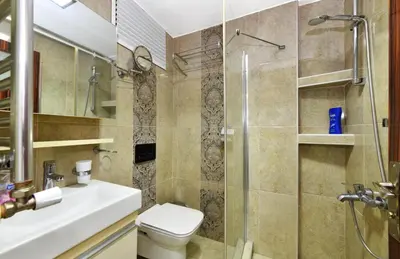 a bathroom with a shower and a toilet and a sink at Castle Suite in Istanbul