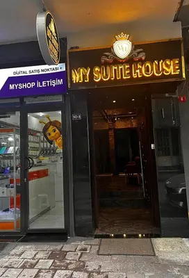 a building with a sign that reads my sunshine house at Hotel Almina İnn in Istanbul