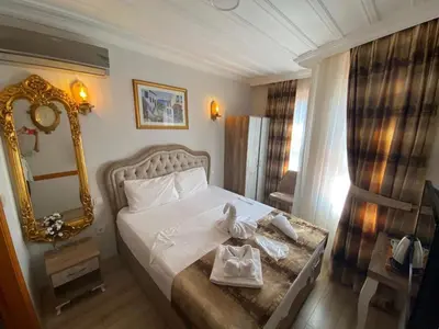 a hotel room with a bed with towels on it at Tree House Otel in Istanbul