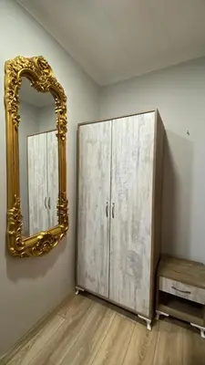 a mirror and a cabinet in a room at Tree House Otel in Istanbul