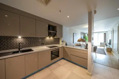 a kitchen with a sink and a stove top oven at Taksim Petek Residence by Guestteori in Istanbul