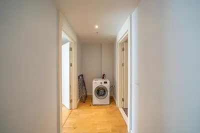a hallway with a washing machine in a room at Taksim Petek Residence by Guestteori in Istanbul
