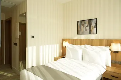 a bedroom with a large bed with white sheets at Tress Hotel in Istanbul