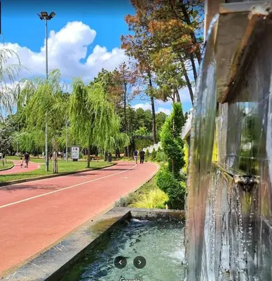 a water fountain with a face drawn on the side of a building at Country , two bedroom and livingroom on Main Street in Çekmeköy