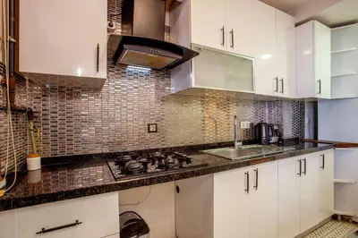 a kitchen with white cabinets and a sink at Mutlu flat in Istanbul
