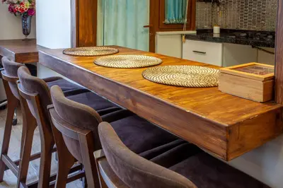 a long wooden table with four chairs around it at Super house 75 mt 2 bedrooms 1 living room Istanbul center in Istanbul