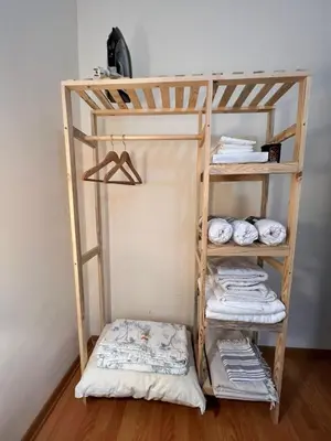 a wooden bunk bed with folded towels and towels at Stylish Triplex with Turkish Bath, Terrace, Central Location in Istanbul