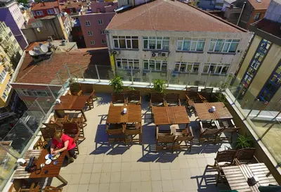 an overhead view of a patio with tables and chairs at Kafkas Hotel Istanbul in Istanbul