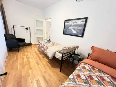 a bedroom with a bed and a chair in it at Central Apartment Close to Galataport in Istanbul