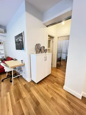 a living room with a desk and a table at Central Apartment Close to Galataport in Istanbul
