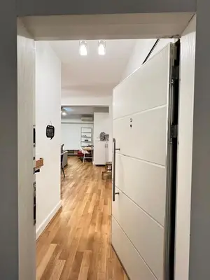 an open door to a kitchen with a refrigerator at Central Apartment Close to Galataport in Istanbul