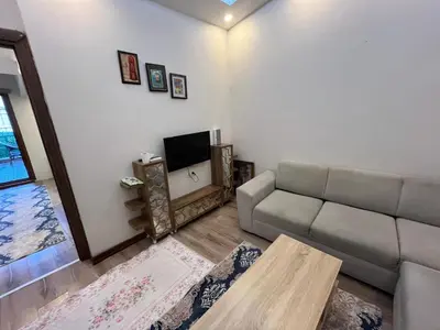 a living room with a couch and a table at Mutlu terrace in Istanbul