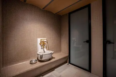 a bathroom with a sink in the corner of a room at Stunning New Balat Water Front Pad! #383 in Istanbul