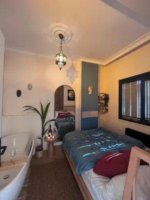 a bedroom with a bed and a bath tub at Rum Otto Enjoy Relax 30 sec to Taksim Bathtub in Istanbul