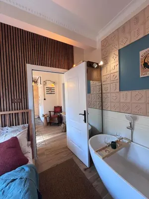 a bathroom with a tub and a bed and a sink at Rum Otto Enjoy Relax 30 sec to Taksim Bathtub in Istanbul