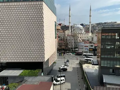 a view of a city with cars parked in a parking lot at Three-room private apartment in Beyoğlu, Central Istanbul in Istanbul