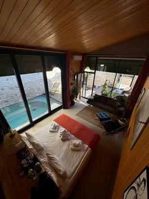 a small room with a bed and a large window at Prime Suites in Kadıköy