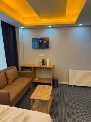 a living room with a couch and a table at Premium Palace in Istanbul