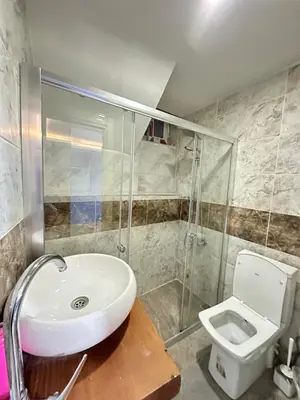 a bathroom with a sink and a toilet at Sevil new apart in Istanbul