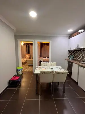 a kitchen with a table and chairs in a room at TAKSİM CMLM Suit in Istanbul