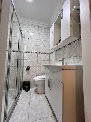 a bathroom with a toilet and a sink and a shower at Sultanahmet Apart Hotel in Istanbul