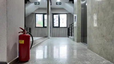 a red fire hydrant sitting in the middle of a hallway at farazarooms in Serdivan