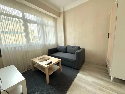 a living room with a couch and a table at Serene in Istanbul