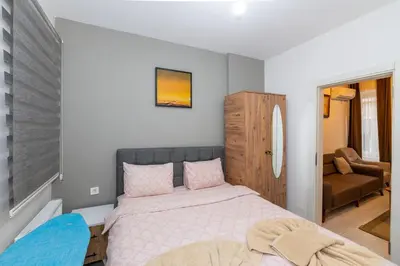 a small bedroom with a bed and a couch at rest at home in Istanbul