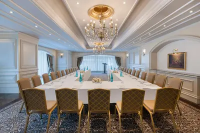 a large room with a large table and chairs at Elite World Istanbul Taksim in Istanbul