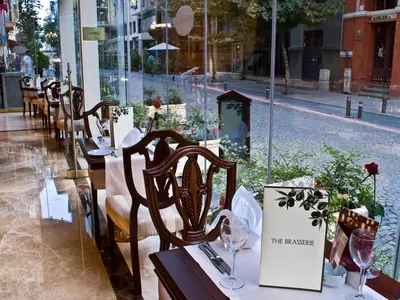 a row of tables and chairs at a restaurant at Elite World Istanbul Taksim in Istanbul