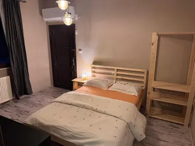 a small bedroom with a bed and a mirror at Keyfe Kadir Garden Butik Otel in Orhangazi