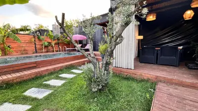 a small tree sitting on the side of a house at Loft Black Sapanca in Sapanca